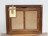 a picture of an old wooden easel with a piece of paper on it