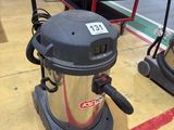 two vacuums that are on the floor in the room