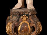an image of a statue of a child standing on top of a table