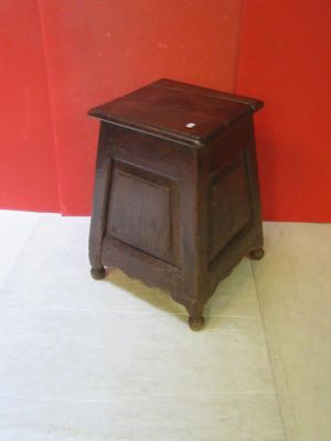 a small wooden table with a drawer on it