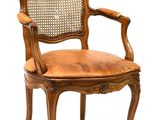 an image of a wooden chair with a brown leather seat