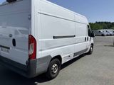 a white van that is parked in a parking lot