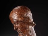 a sculpture of a man ' s head with a beard