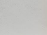 a black and white photo of a man riding a snowboard