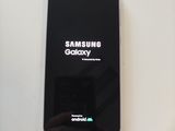 a picture of a black samsung galaxy phone on a table