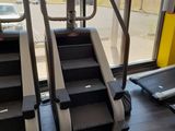 a treadmill and a tread machine in a gym room