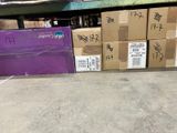 many boxes that are stacked on the floor in the warehouse