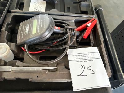 a box with a battery and a charger inside of it