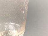 a close up of a glass of water on a table