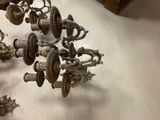 a lot of antique metal objects on the floor