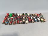 a lot of toy trains on a white surface