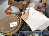 a pile of assorted items sitting on a table in a warehouse