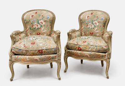 pair of louis xv style upholstered armchairs with floral upholstered cushions
