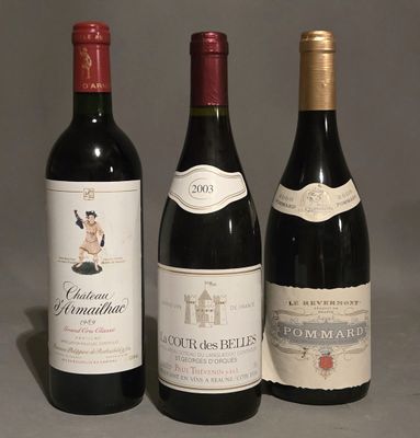 three bottles of wine sitting next to each other on a table