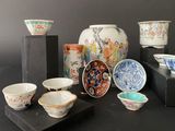 many different bowls and bowls on display on a table
