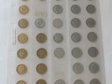 a lot of coins in a plastic bag on a table