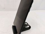 a tablet that is sitting on a stand on a table