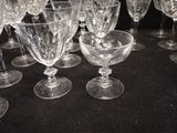 many wine glasses lined up on a black table
