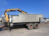 a dump truck that is parked on the side of the road