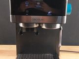 a coffee machine that is sitting on a wooden table