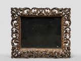 an old wooden frame with a mirror on a white background