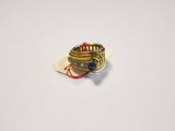 a picture of a gold ring with a blue stone