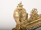 a gold statue of a man and a woman riding on a boat