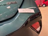 a sticker on the back of a car with a name on it
