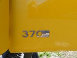 a close up of the number 3770 on the side of a yellow truck