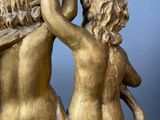 statue of a pair of cherenshes holding hands in the air