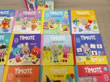 several children ' s books are lined up on the floor