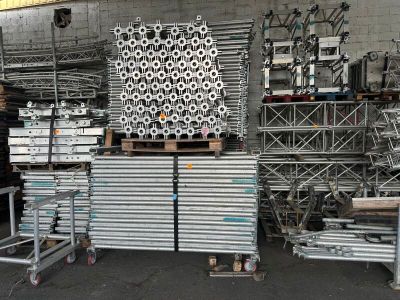 a large pile of metal items in a warehouse