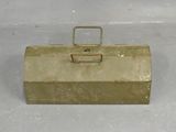 gold metal tool box with handle and latch on white surface