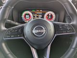 a steering wheel and dashboard of a nissan vehicle