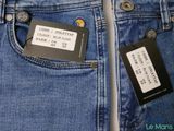 two pairs of jeans with a price tag in the back pocket of a pair of jeans