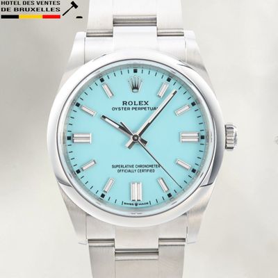 rolex oyster power blue dial watch with stainless steel bracelet