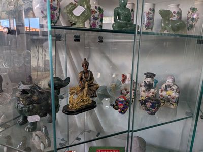 a glass case with a lot of different items in it
