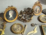 a table with a lot of antique items on it
