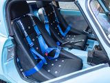 two seats in the back of a car with blue trims