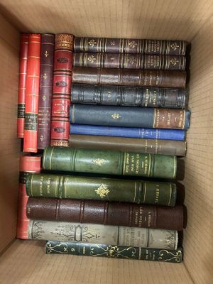 a box full of old books sitting on a table