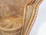 a wicker chair with a basket on top of it