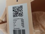 a label on the bottom of a pair of ballet shoes