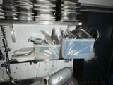 many pots and pans on the shelf in the kitchen
