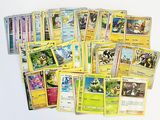 a lot of pokemon cards that are on the table