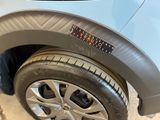 a close up of a car tire with a sticker on it