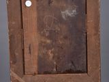 an old wooden easel with a painting on top of it