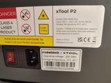 a label on the back of a machine that says tool p2