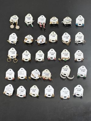 a lot of small white tags that are on a table