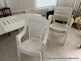 a white table and two chairs in a room