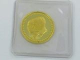 a picture of a gold coin with a picture of a man on it